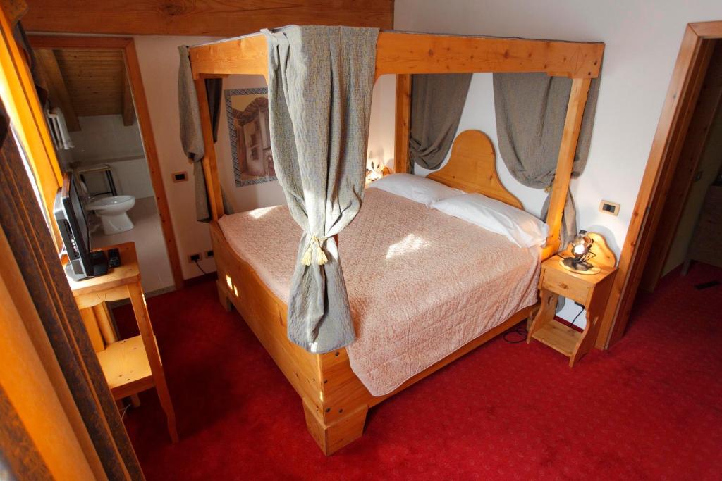 Postel nebo postele na pokoji v ubytování Hotel Aurora