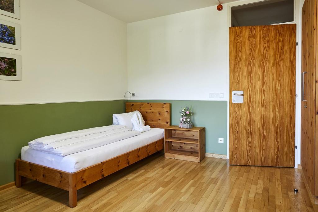 Postel nebo postele na pokoji v ubytování FAST Ossiach
