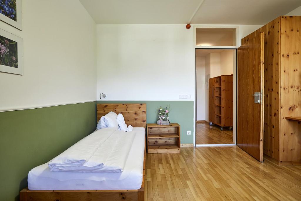 Postel nebo postele na pokoji v ubytování FAST Ossiach