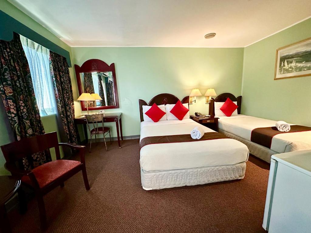 Postel nebo postele na pokoji v ubytování Palladium Suites Hotel