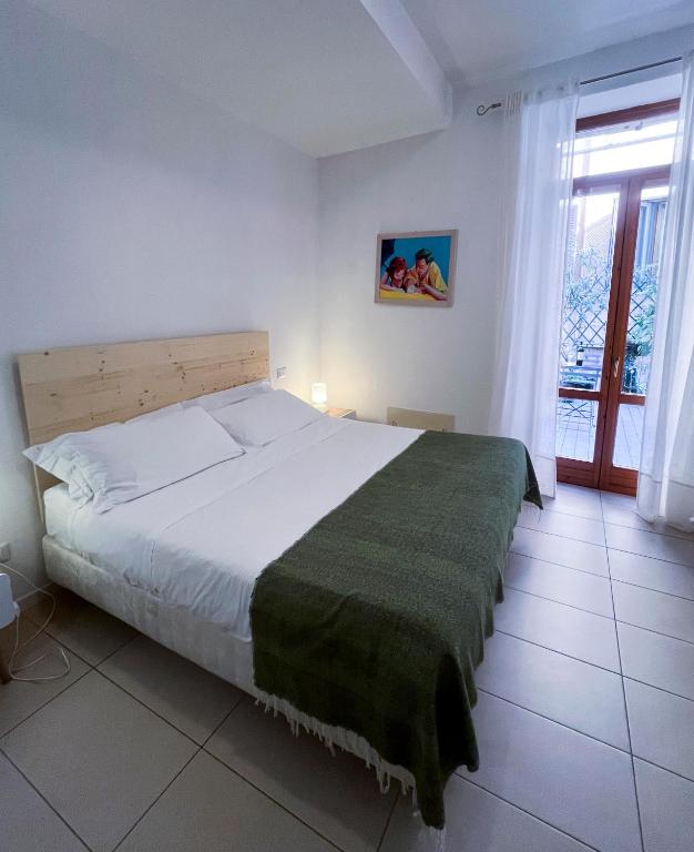 Postel nebo postele na pokoji v ubytování B&B Ponte Manin