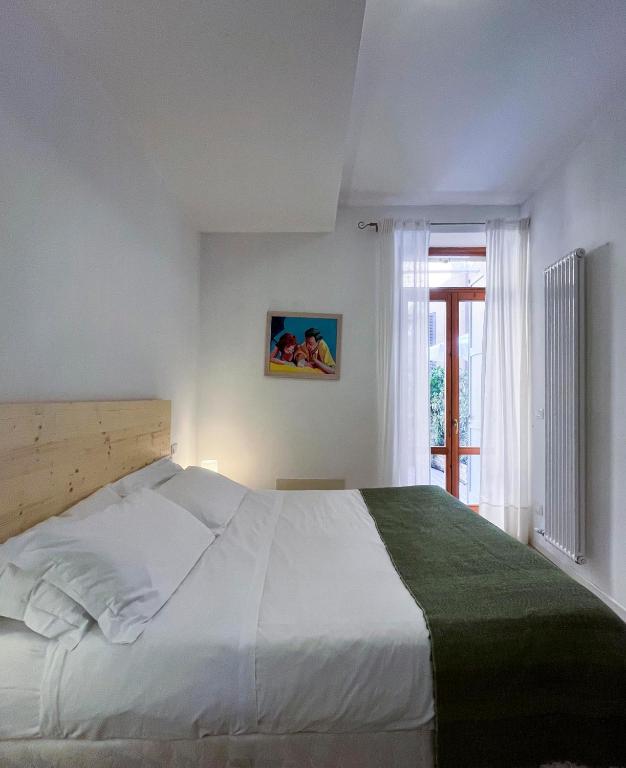 Postel nebo postele na pokoji v ubytování B&B Ponte Manin