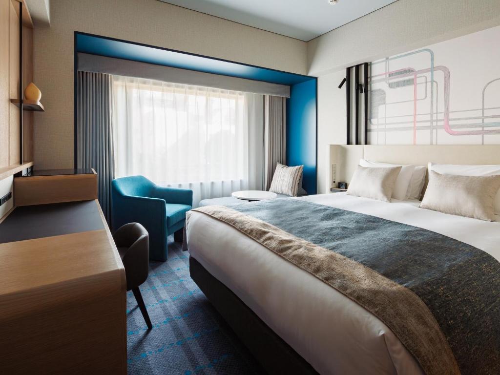 Postel nebo postele na pokoji v ubytování Hotel Metropolitan Tokyo Ikebukuro