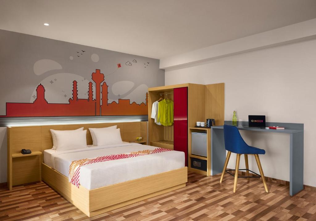 Postel nebo postele na pokoji v ubytování Ginger Ahmedabad Changodar