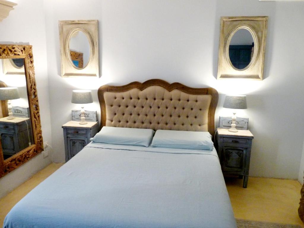 Postel nebo postele na pokoji v ubytování Palazzo San Giuseppe