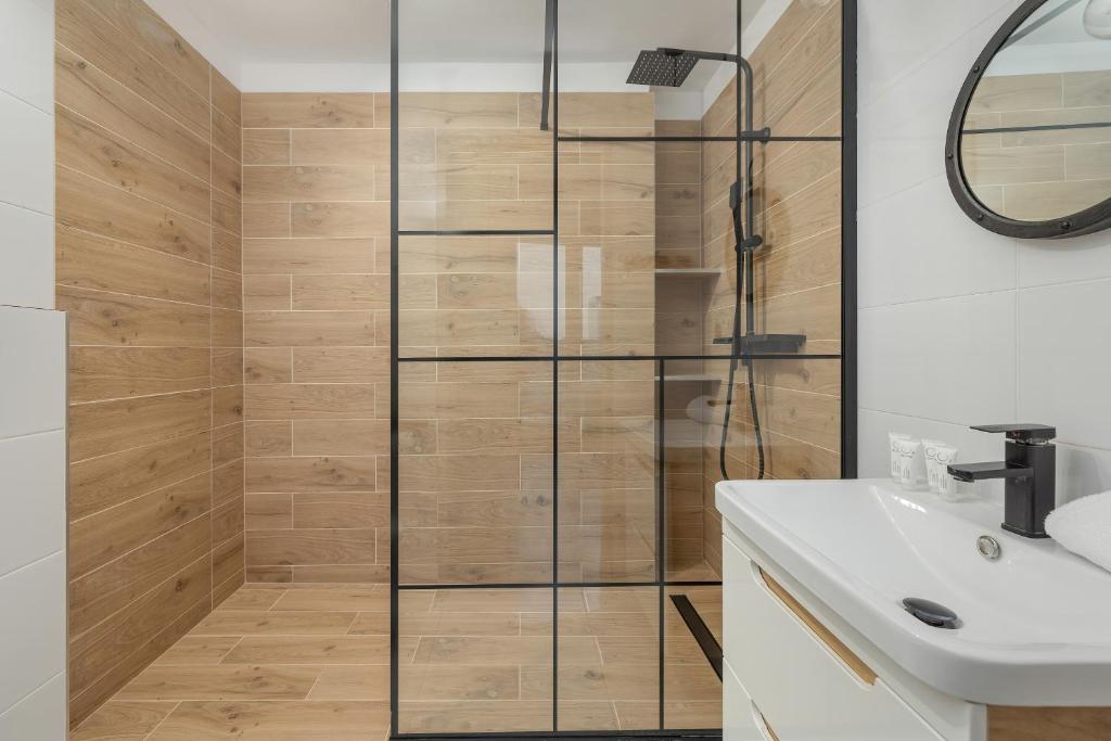 Kúpeľňa v ubytovaní Etna Apartments Kołobrzeg by Noclegi Renters