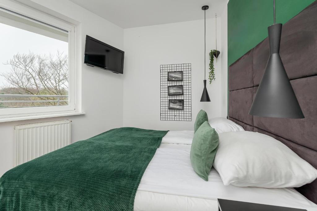 Posteľ alebo postele v izbe v ubytovaní Etna Apartments Kołobrzeg by Noclegi Renters