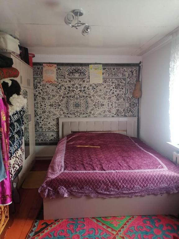 Postel nebo postele na pokoji v ubytování Mariyam Guest House