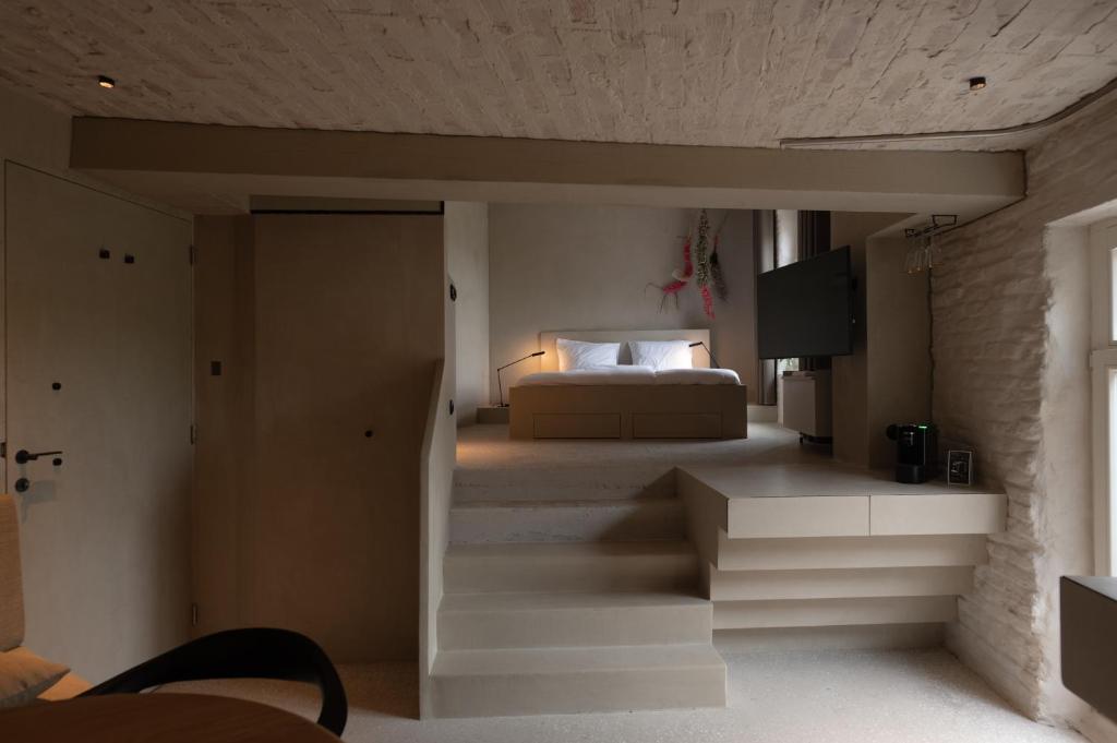Postel nebo postele na pokoji v ubytování Luxe in Het Posthuis - nieuwe Stijlvolle Verblijven in Oud-Rekem