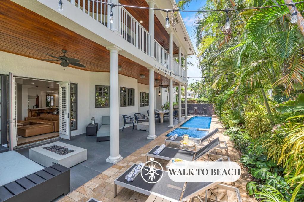 a villa with a swimming pool and a walk to beach at Florida Keys Villa Beach Proximity Heated Pool Serenity at its Finest Hemingway Key VlLLAS in Fort Lauderdale