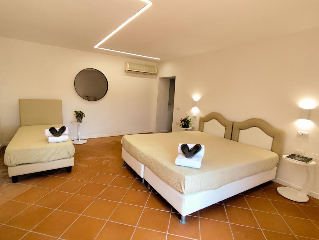 Łóżko lub łóżka w pokoju w obiekcie Agriturismo - Collina Toscana Resort