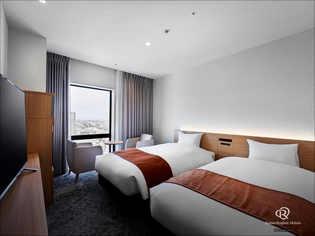 Postel nebo postele na pokoji v ubytování Daiwa Roynet Hotel Omiya-nishiguchi
