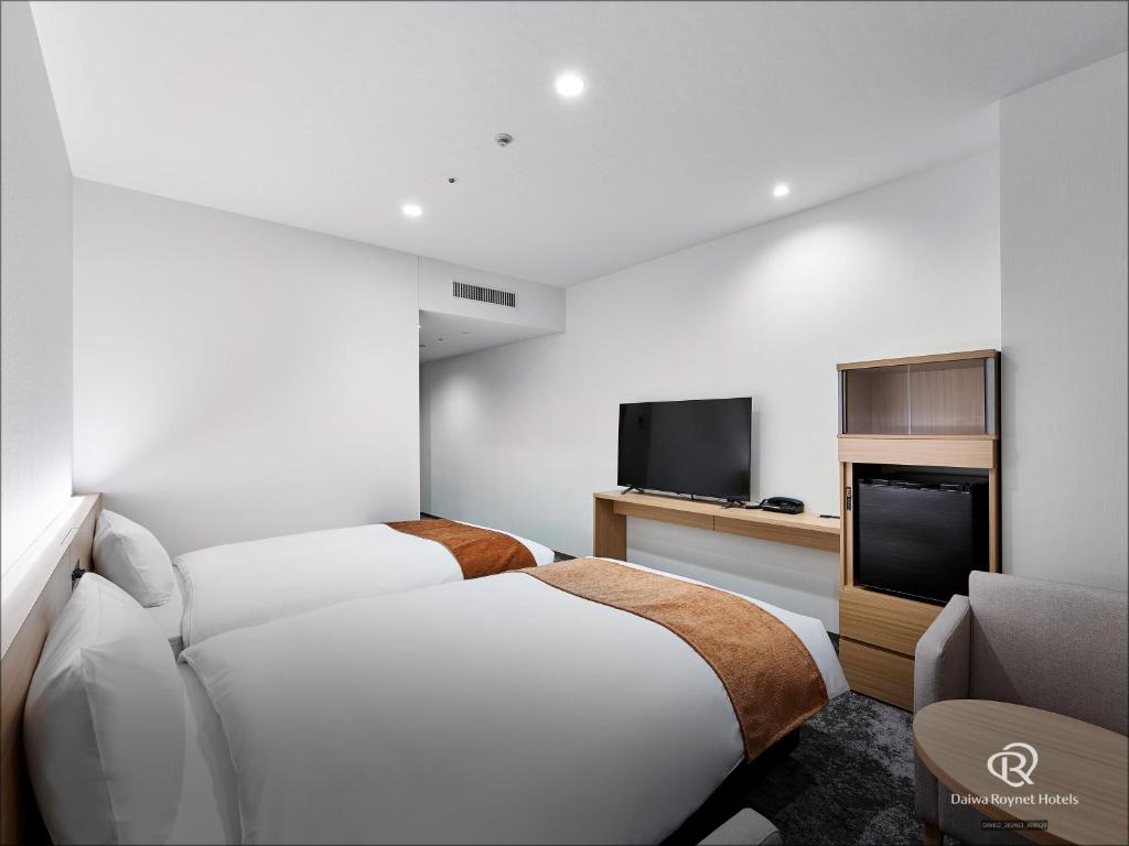 Postel nebo postele na pokoji v ubytování Daiwa Roynet Hotel Omiya-nishiguchi
