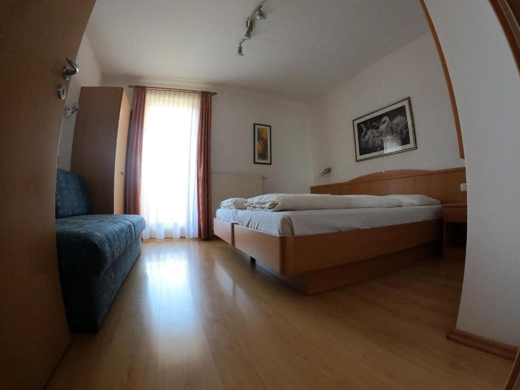 Postel nebo postele na pokoji v ubytování Residence Emma