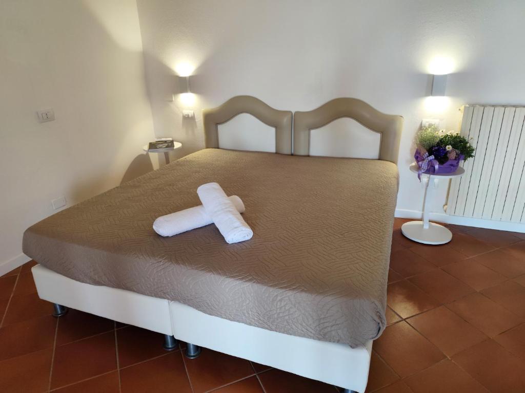 Łóżko lub łóżka w pokoju w obiekcie Agriturismo - Collina Toscana Resort