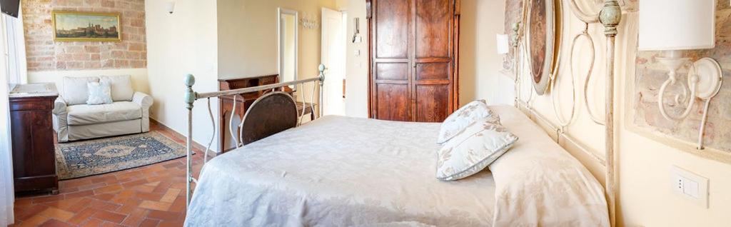 Postel nebo postele na pokoji v ubytování Hotel Il Castello