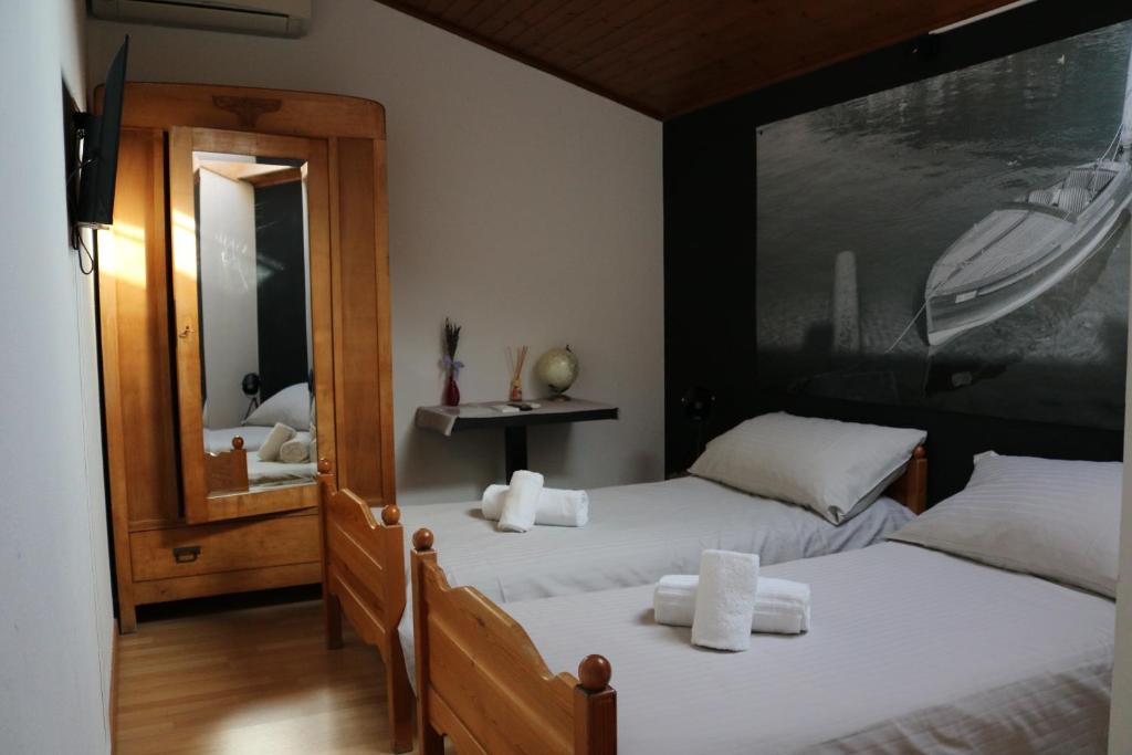Postel nebo postele na pokoji v ubytování Borgovecchio Albergo
