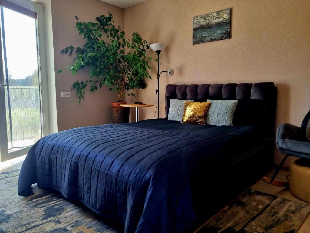 Postel nebo postele na pokoji v ubytování Garden Studio by the Lake with Air-Con and Infrasauna