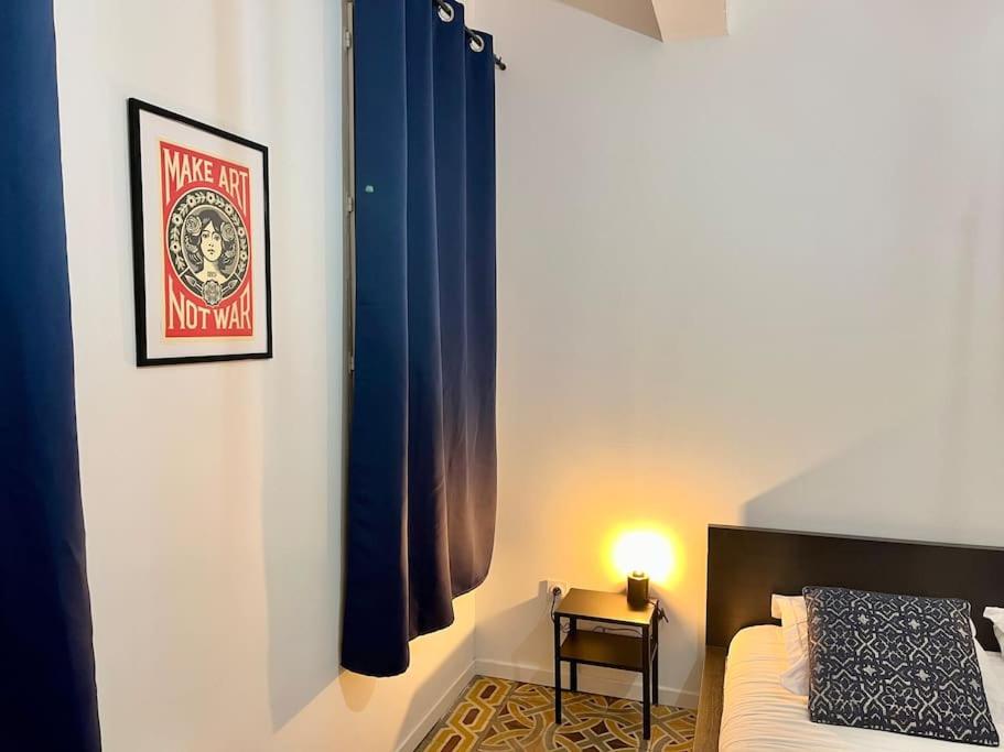 Postel nebo postele na pokoji v ubytování Appartement Victor Hugo - balcon