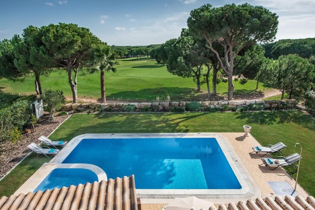 Utsikt över poolen vid Villa Palm Golfe, fantastic house on Vila Sol course, kids pool, aircon eller i närheten