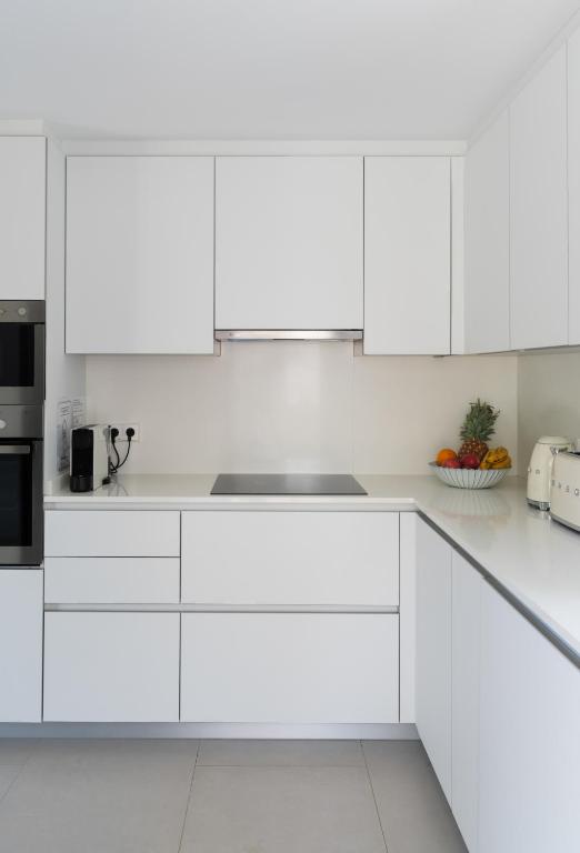 A kitchen or kitchenette at Villas Guzman - Artista