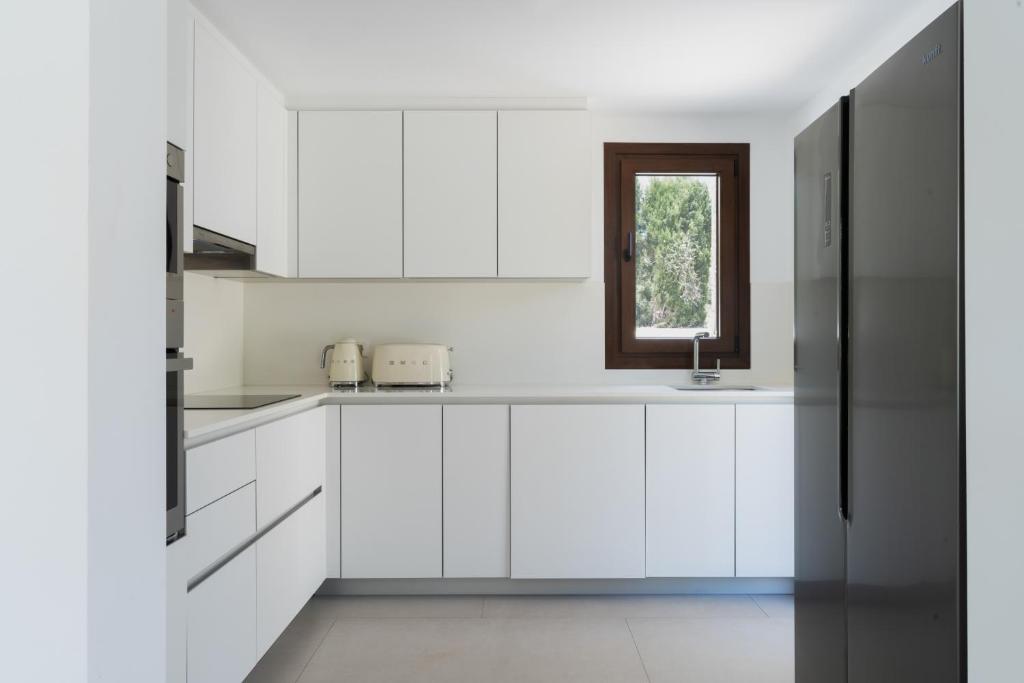 A kitchen or kitchenette at Villas Guzman - Artista