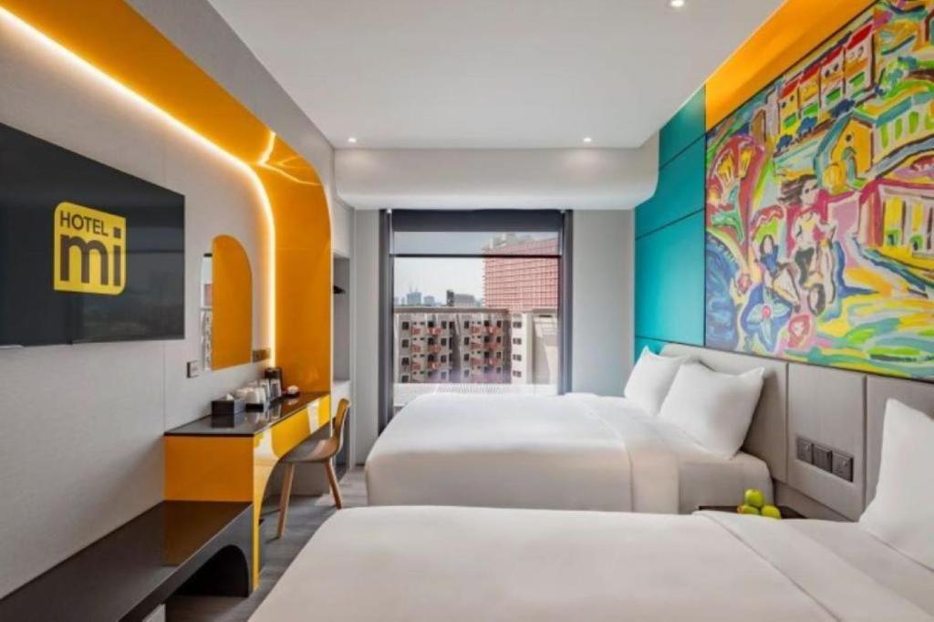 Giường trong phòng chung tại Hotel Mi Rochor