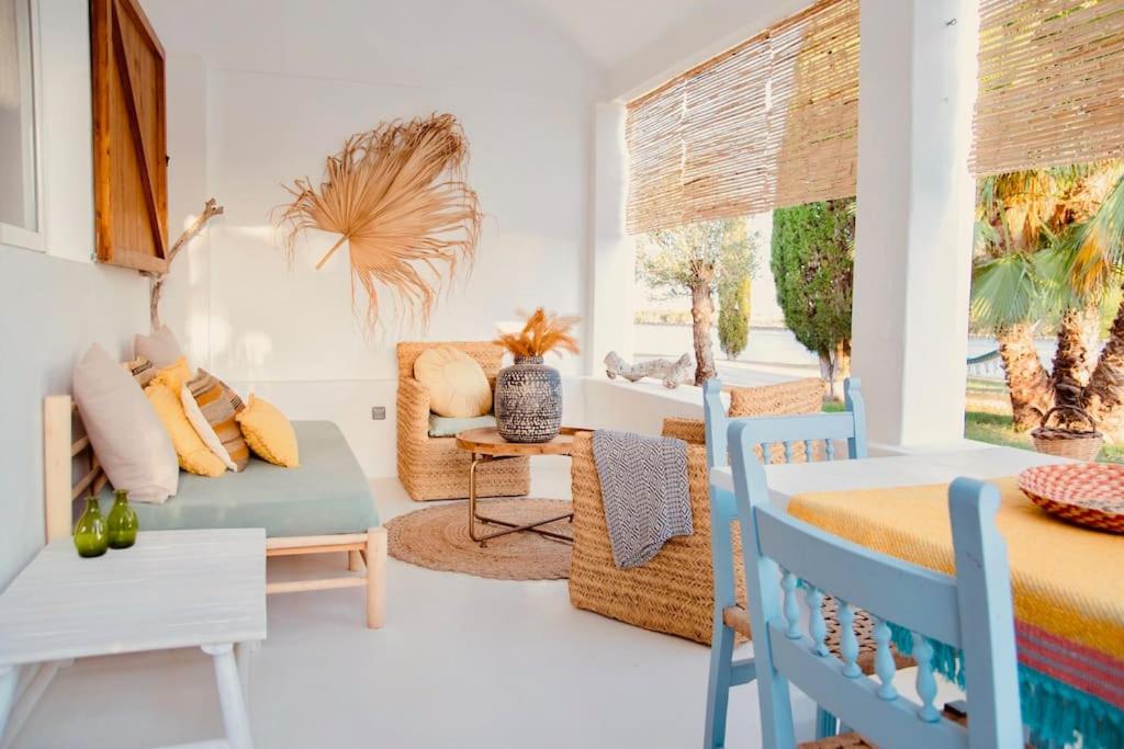 een woonkamer met een bed en een bank bij Home / Rural Modern House in Sant Ferran de Ses Roques