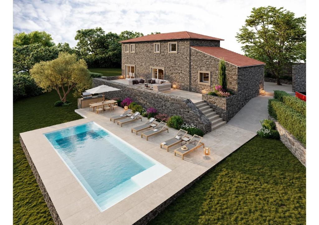 an aerial view of a house with a swimming pool at Reverence Villas Caldelas in Antas de Ulla