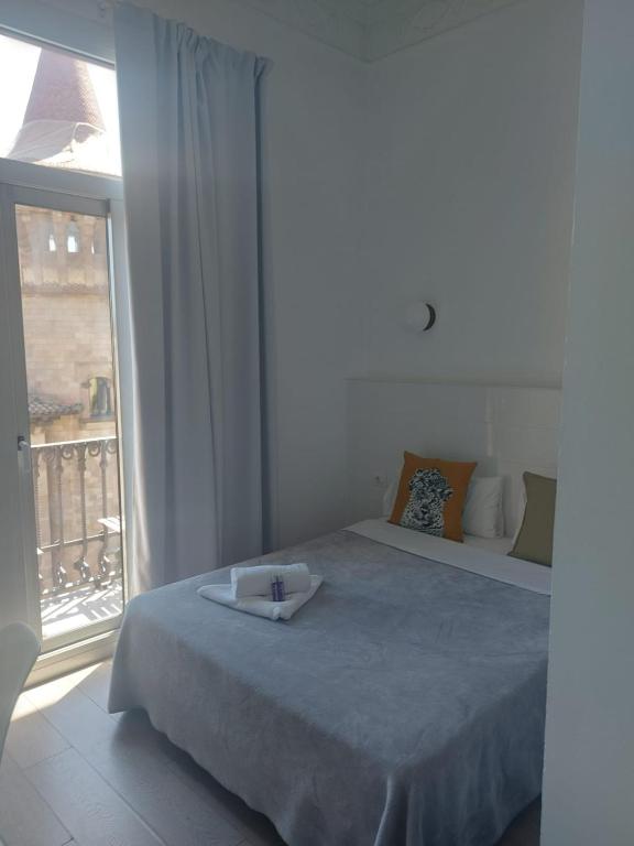 Posteľ alebo postele v izbe v ubytovaní Hostal Argo