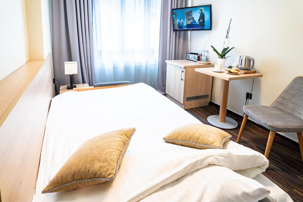 Postel nebo postele na pokoji v ubytování Ośrodek Szkoleniowo-Wypoczynkowy "Leśnik"