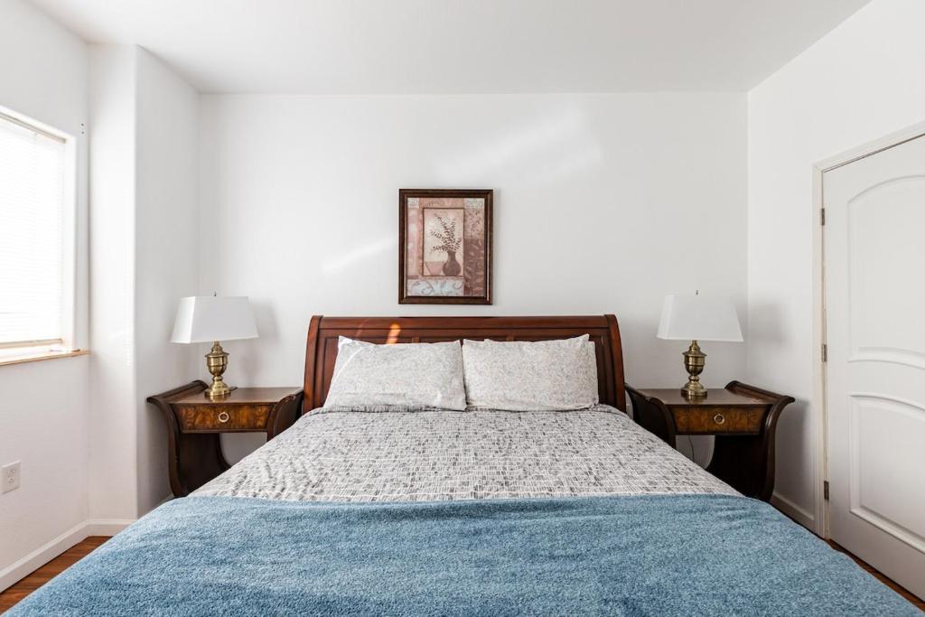 a bedroom with a large bed with two night stands at Bluenose Bed and Breakfast in Halifax