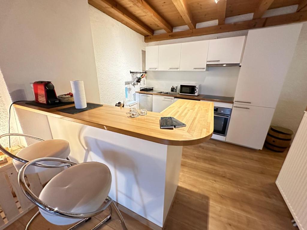 Kuchyň nebo kuchyňský kout v ubytování Chez Alain Prévu - Boutique Hotel by Stay Swiss