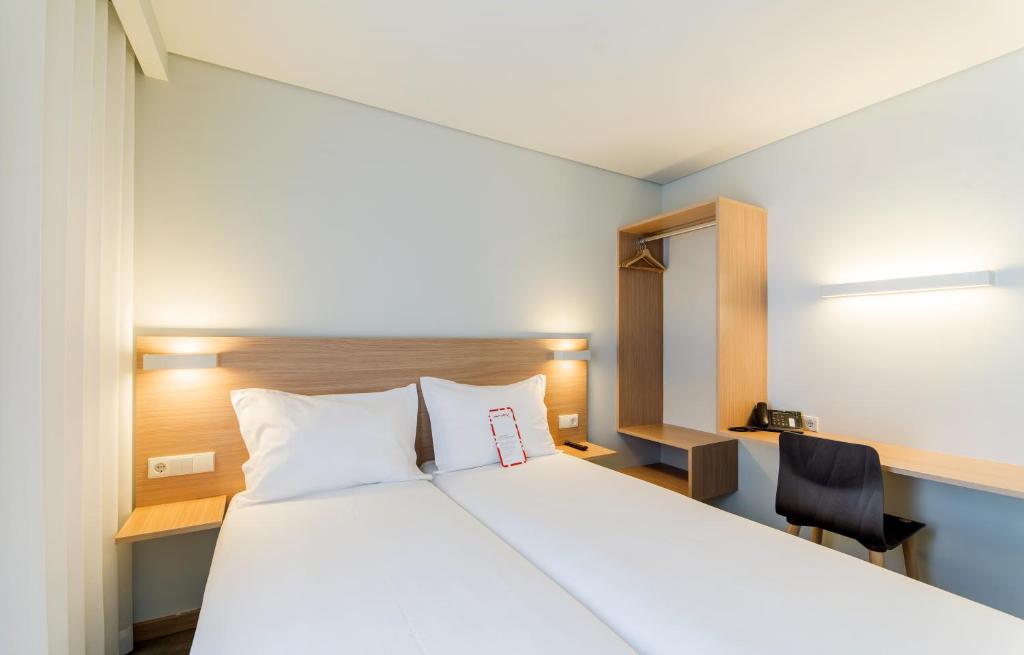 Postel nebo postele na pokoji v ubytování Moov Hotel Porto Norte