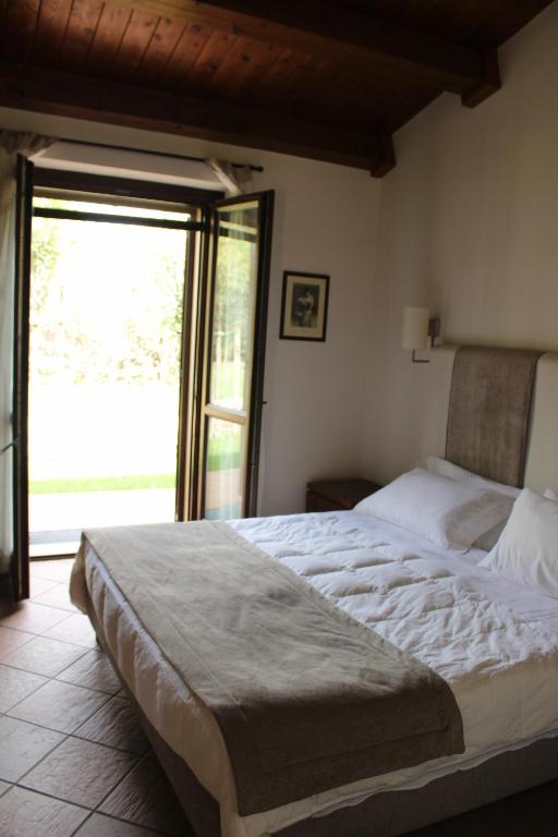 Postel nebo postele na pokoji v ubytování Masseria Pietrafitta