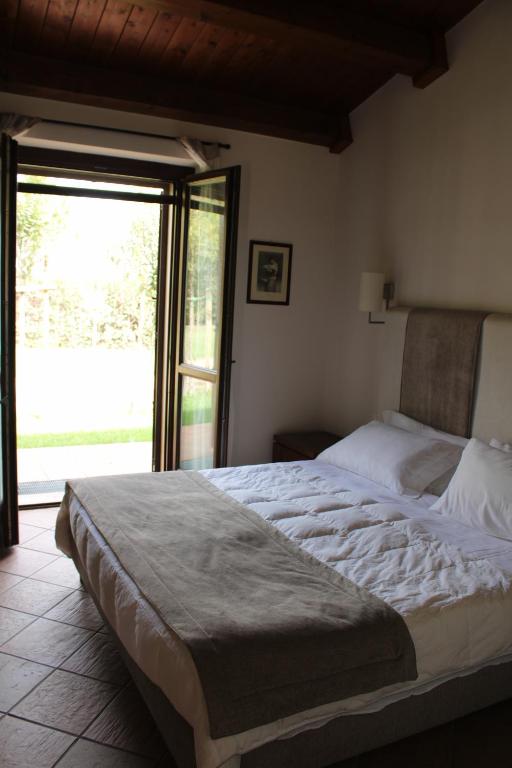 Postel nebo postele na pokoji v ubytování Masseria Pietrafitta