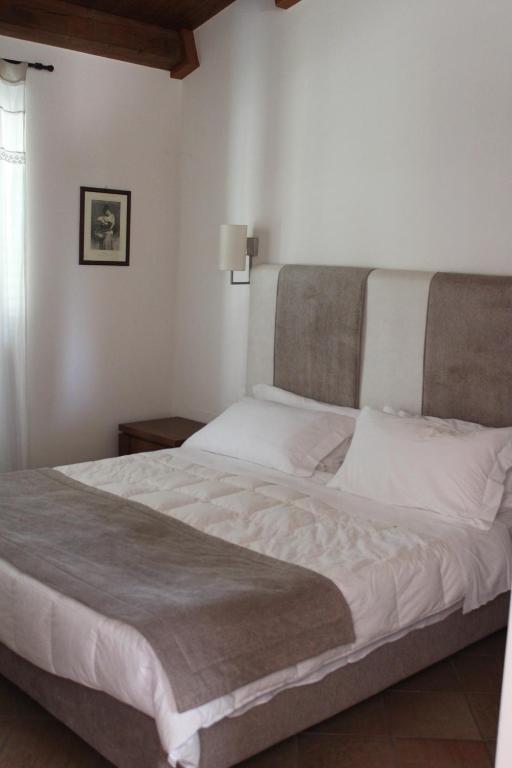 Postel nebo postele na pokoji v ubytování Masseria Pietrafitta