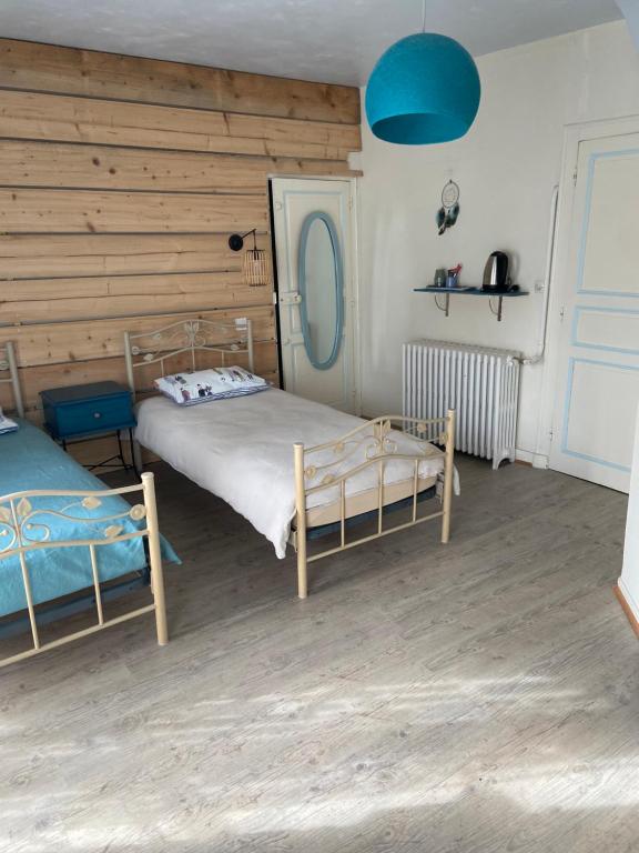 Postel nebo postele na pokoji v ubytování Atipyk'ododo
