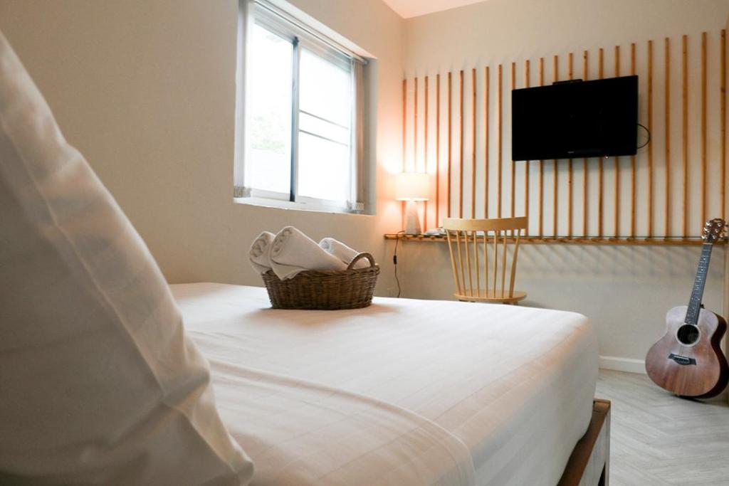 מיטה או מיטות בחדר ב-Shanti-Retreat Hotel