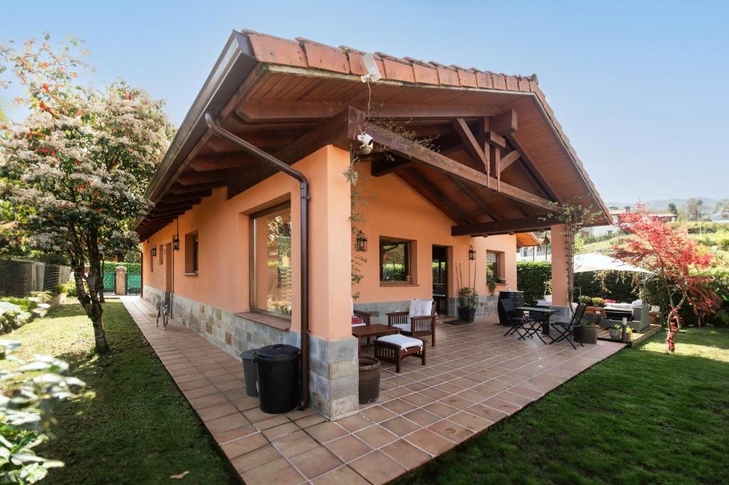 a house with a patio with a roof at Villa La Marquesa de Llanes in Llanes