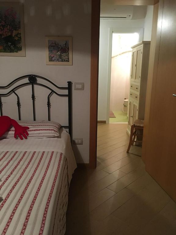 Postel nebo postele na pokoji v ubytování Petali Rosa - Dimora Pietra