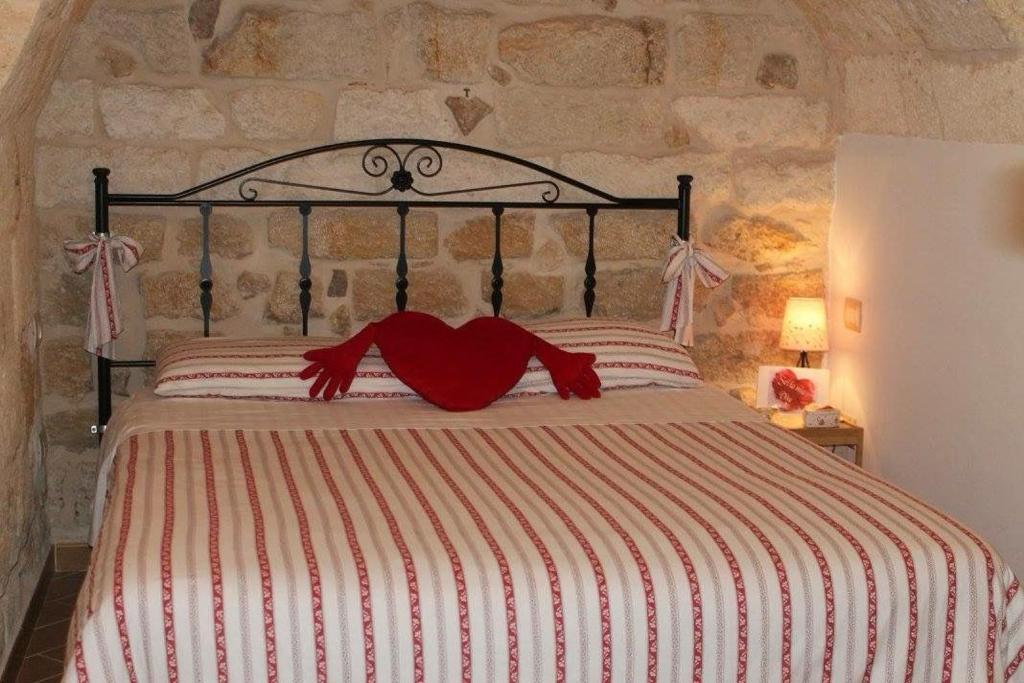 Postel nebo postele na pokoji v ubytování Petali Rosa - Dimora Pietra