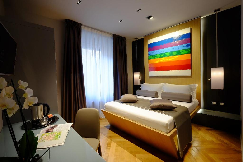Postel nebo postele na pokoji v ubytování Navona Rooms