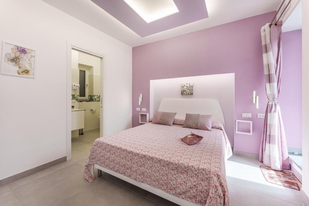 Postel nebo postele na pokoji v ubytování Le Rondinelle Rooms