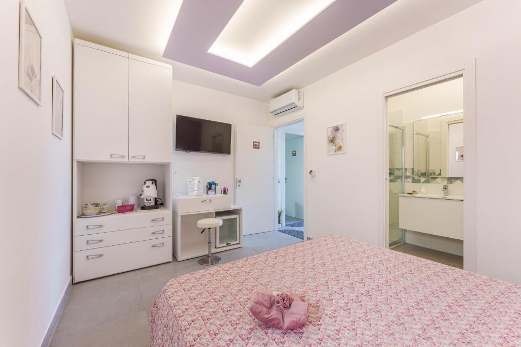 TV a/nebo společenská místnost v ubytování Le Rondinelle Rooms