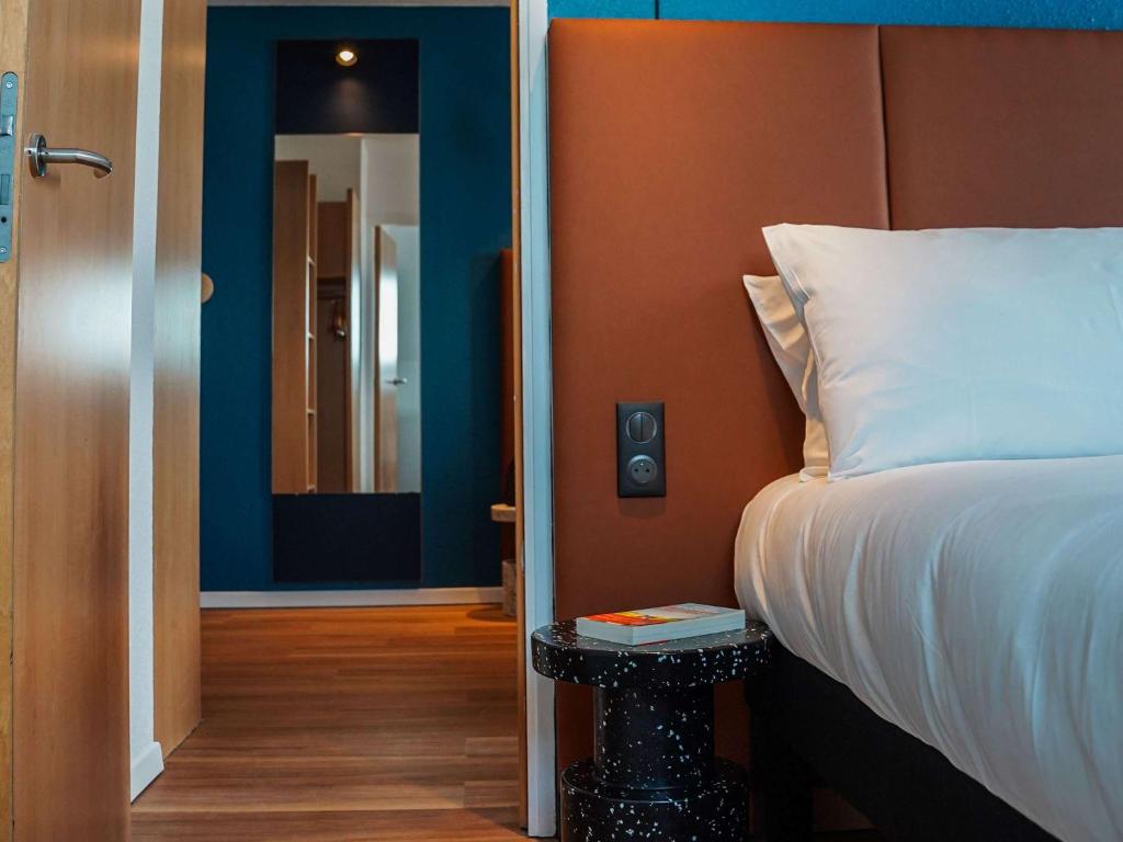 Кровать или кровати в номере ibis Bayeux Port En Bessin