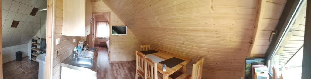 an overhead view of a room with a wooden ceiling at W Cisnej pod 1. in Cisna