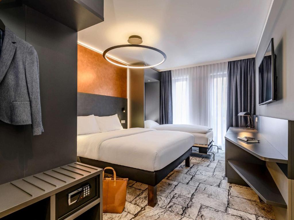 Postel nebo postele na pokoji v ubytování ibis Styles Bamberg