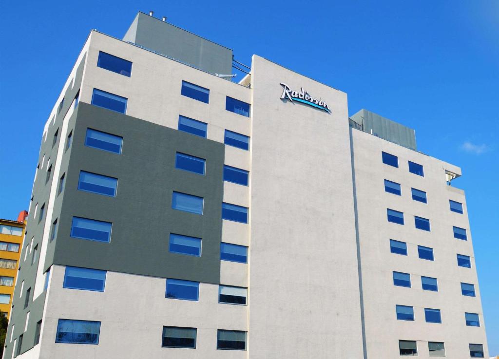 a building with a nvidia sign on the side of it at Radisson Hotel Curico in Curicó