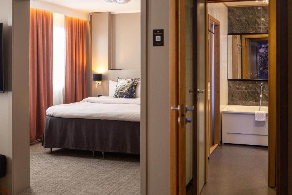 Postel nebo postele na pokoji v ubytování Starby Spa, Hotell & Konferens